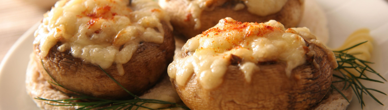 Як приготувати фаршировані печериці з сиром у духовці